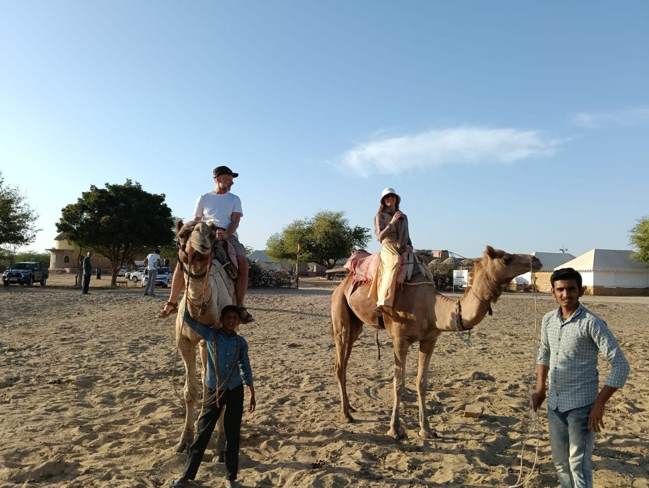 Travelers exploring the green hills of Rajasthan